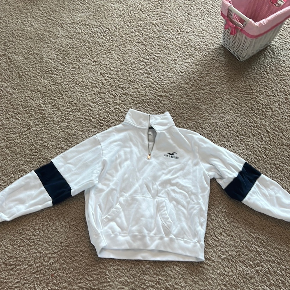 a white and navy blue hollister hoodie